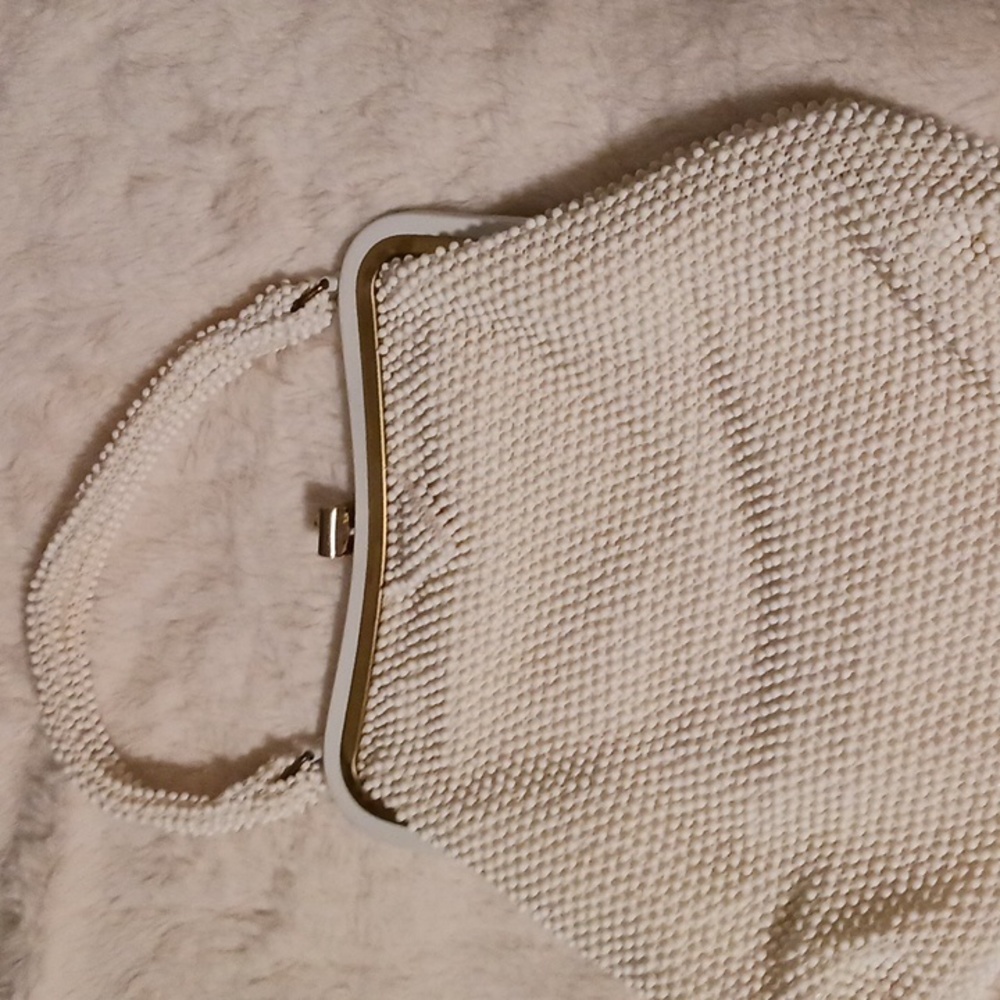 Corde-Bead made in USA handbag white beading outside , on handle ornate closure